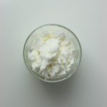 A clear glass bowl filled with sweet whey powder used in baked goods, confectionery products and more.